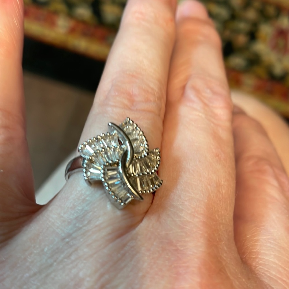 This is 925 sterling silver ring of all clear stones not diamonds.